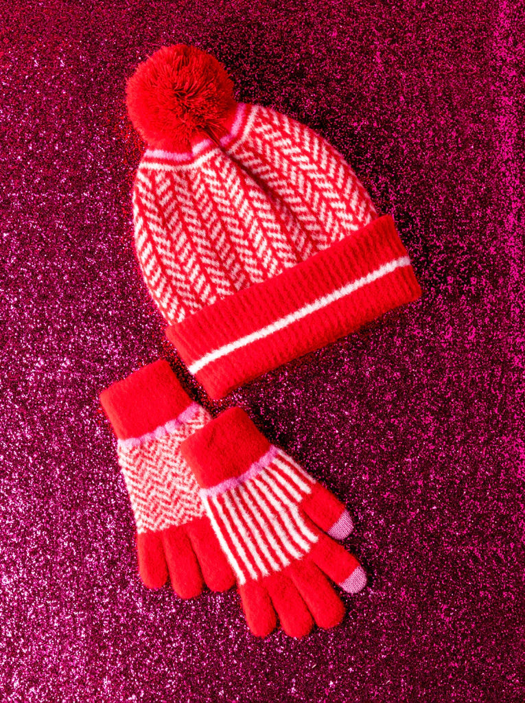 Spruce up your cold weather accessories with Shiraleah's Bowie Touchscreen Gloves. These gloves feature a cozy material in a trendy stripe and zigzag pattern. Made from nylon, polyester, and elastane with a functional touch screen compatible fingertip detail