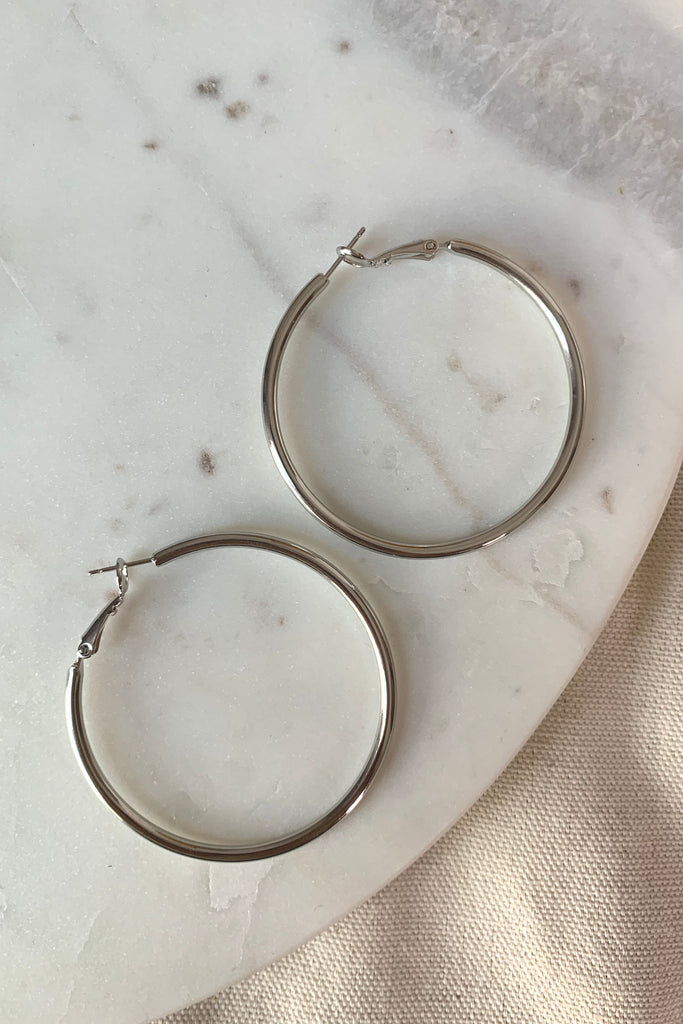 Elevate any outfit with a bold and eye-catching statement hoop. These large slim Gold Dipped Hypoallergenic Hoop Earrings are perfect for your everyday wear due to their lightweight design. Add a dose of style and confidence to complete your look!