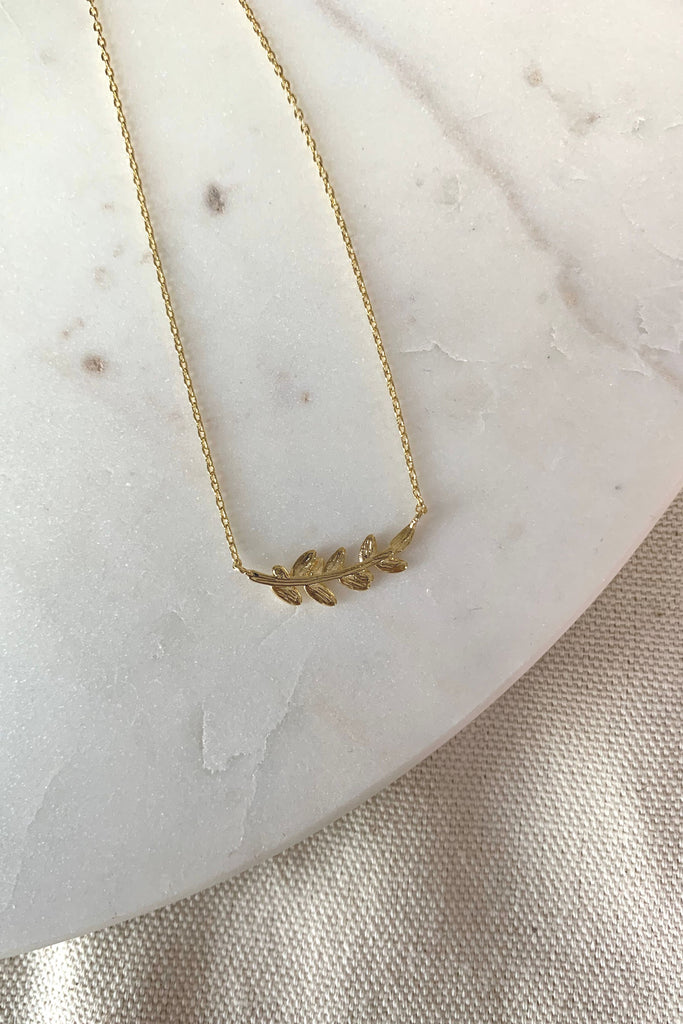 This charming necklace features a gold dipped vine and leaf charm that will add a subtle elegance to any outfit. Its lightweight and dainty design make it perfect for everyday wear. Grab one for yourself, or wrap it up as a sweet gift. 