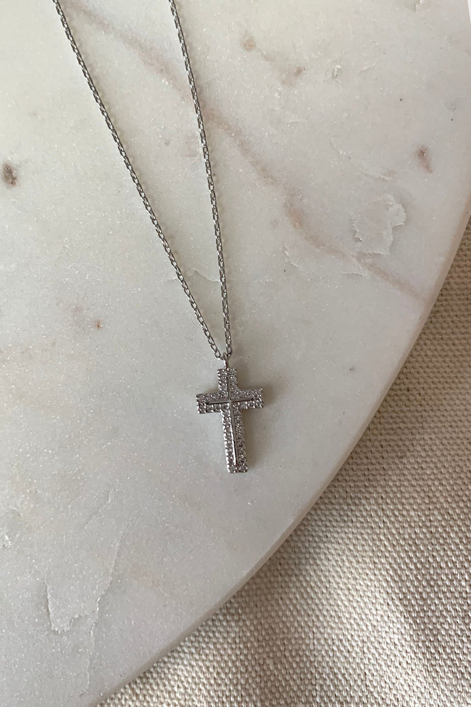 Treat yourself to some sparkle and confidence with this beautiful silver cross necklace. It features an elegant cross adorned with shimmering crystal stones, sure to add a touch of sophistication to your look. This stunning necklace also makes a great gift!