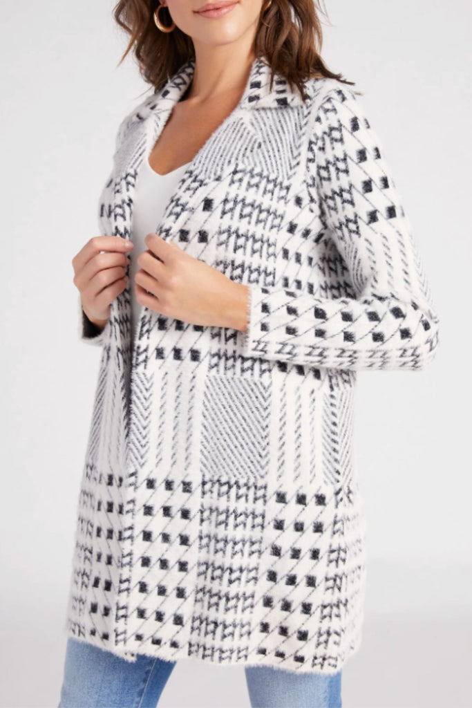 We are bringing back the  Liverpool Open Front Sweater Coatigan-the chic combination of a coat and a cardigan! It's the perfect weight, ultra cozy, and has a gorgeous print. This style is white and features a black mixed plaid design. You could dress this jacket up or down for countless occasions.