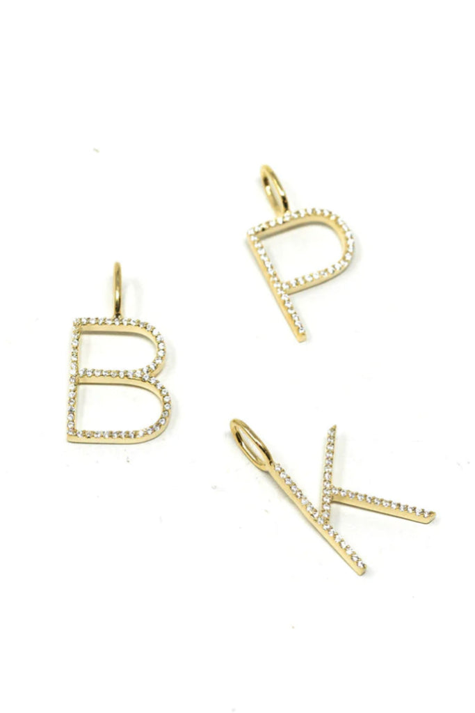 Personalize your look with the Sis Kiss Charm Bar! These sleek initials are so fun and add little flare to you look. Choose between gold or silver. Layer up with our other charms for an extra fun necklace. 