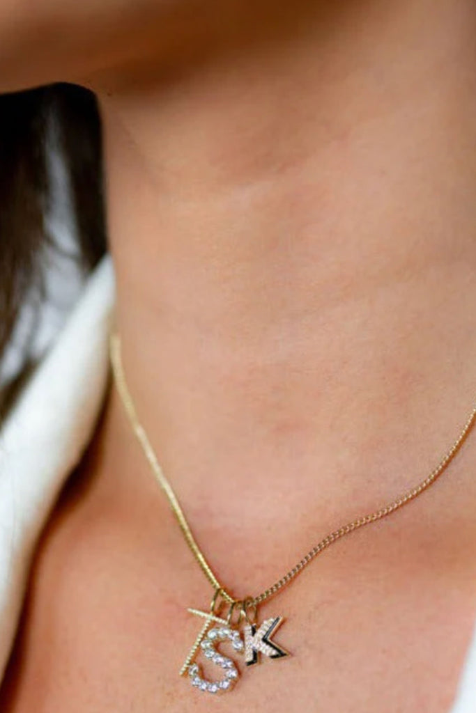 Choose your favorite chains and charms! The Sis Kiss Skinny Curb Chain Necklace is the perfect foundation for a great necklace. It's sleek with 14k plating. Just add one of our Sis Kiss Charms to complete your look! Material: 14k gold or sterling silver plated brass