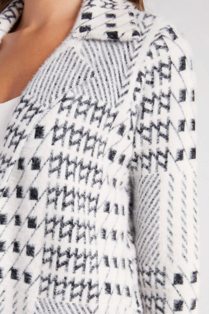 We are bringing back the  Liverpool Open Front Sweater Coatigan-the chic combination of a coat and a cardigan! It's the perfect weight, ultra cozy, and has a gorgeous print. This style is white and features a black mixed plaid design. You could dress this jacket up or down for countless occasions.