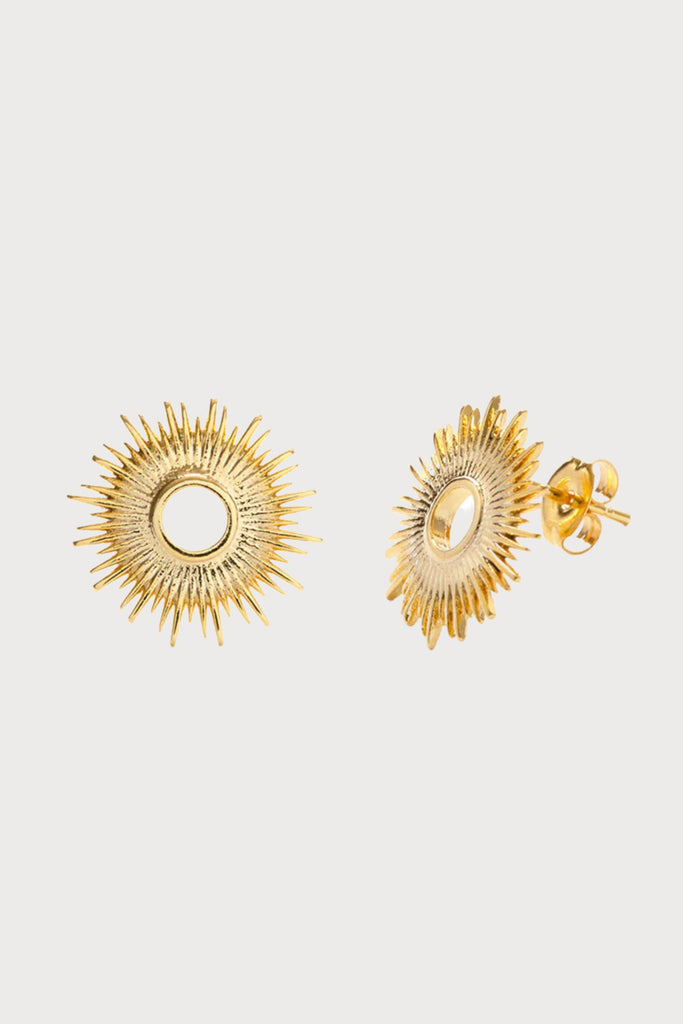 Inspired by California coast sunshine, the Sunburst Studs by Amano Studio add a little glow to any look. The sun, giver of life, is a powerful symbol and talisman. This is our homage to el sol. Made of brass with a heavy (7-10 mil) 24k gold plate.