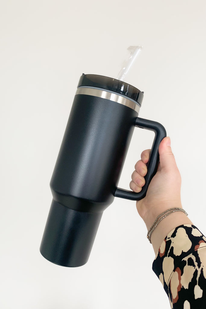 Stay hydrated in style with our 40 oz Quencher Cup! It's stainless steel, BPA Free with double wall vacuum insulation! This cup features an ergonomic handle with comfortable grip. It also features a reusable straw, is dishwasher safe, and fits in most car cup holders.