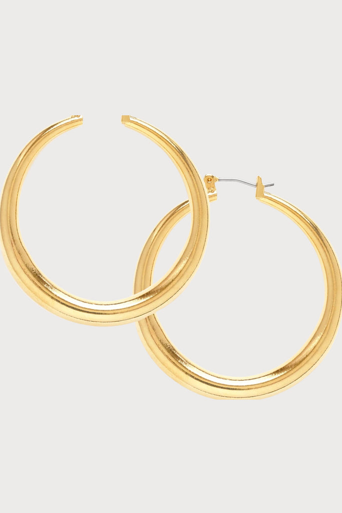 We call these the Amano Studio Small Maria hoops because they remind us of a something a Spanish dancer would wear. They are lightweight, classic, and of course they can also be styled to have a clean, bold look that was popular in the 70's. 