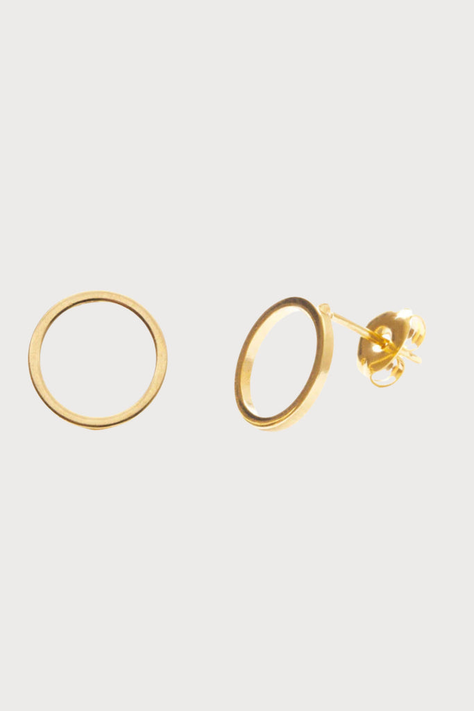 Slightly larger than the small circle studs, the Amano Studio Modern Circle Studs are unique and make a playful statement. These gold circles look so interesting on. Very modern and minimalist. Made of brass with a heavy 24k gold plate in the USA