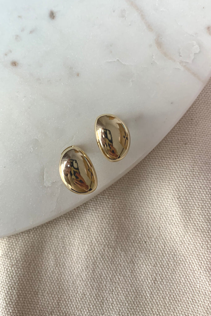 Our Gold Dipped Bean Stud is so classic and pretty! It's lightweight and will add a dressy element to any look. 