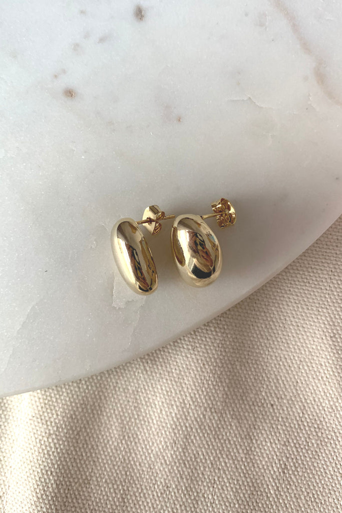 Our Gold Dipped Bean Stud is so classic and pretty! It's lightweight and will add a dressy element to any look. 