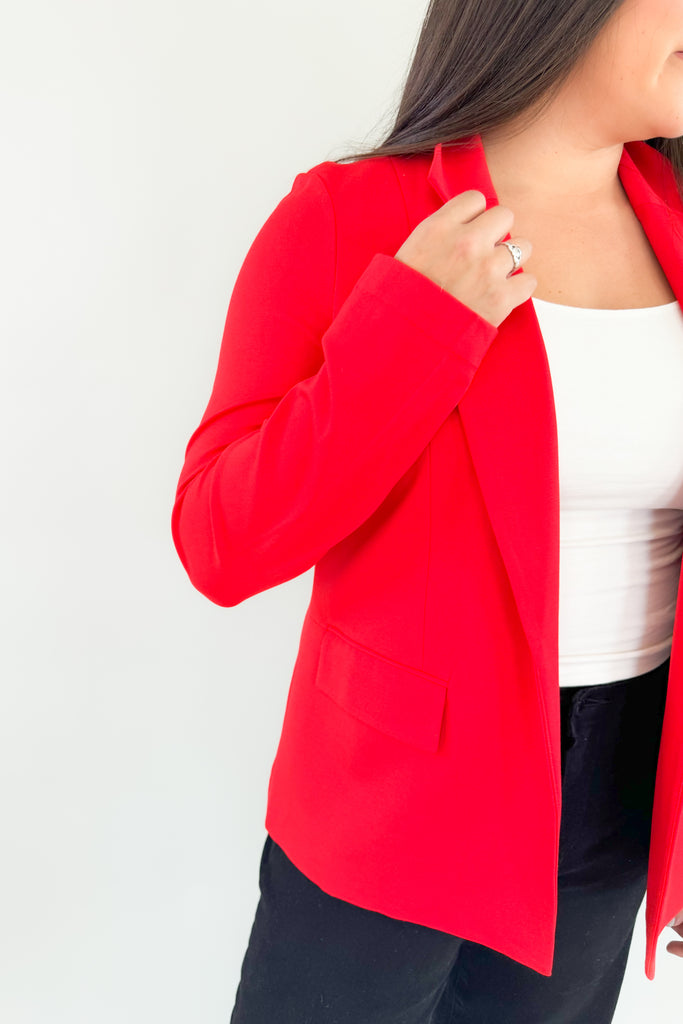 Be confidently stylish in this Alana Stretch Blazer. Its red exterior stretches for a perfect fit and the beautiful blue floral lining adds a playful touch. This style will be perfect for holidays and will remain classic for years to come. You could wear this blazer for holiday events, work, or dress up a casual outfit. 