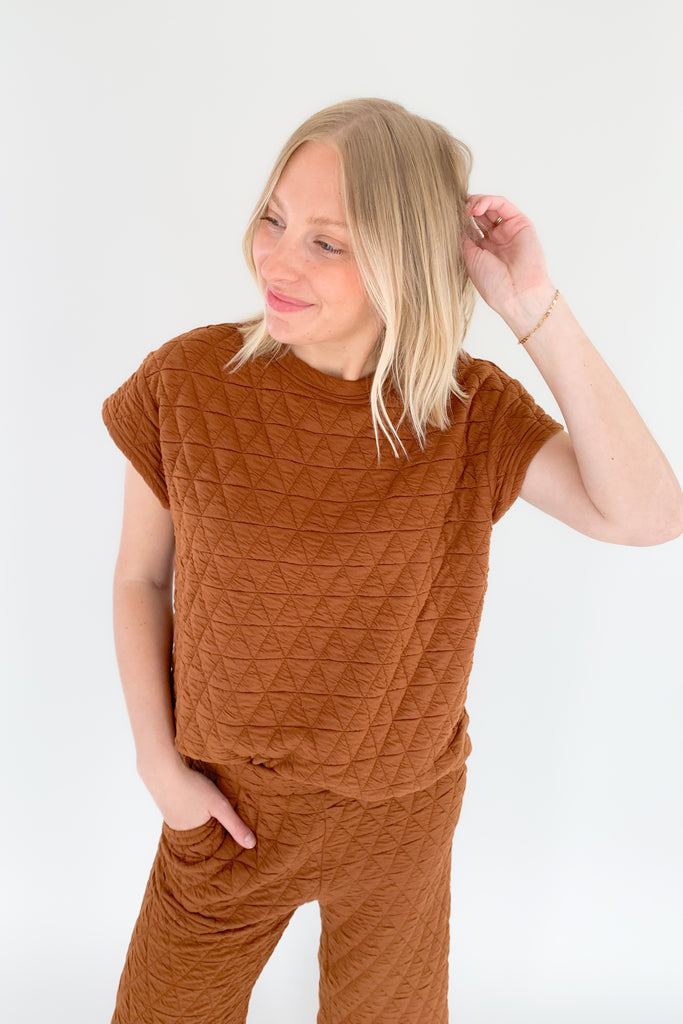 The Ashlee Quilted Short Sleeve Top is elevated with a unique quilted texture and boxy shape. It is very flattering and trendy while remaining comfortable. The style is not heavy either.