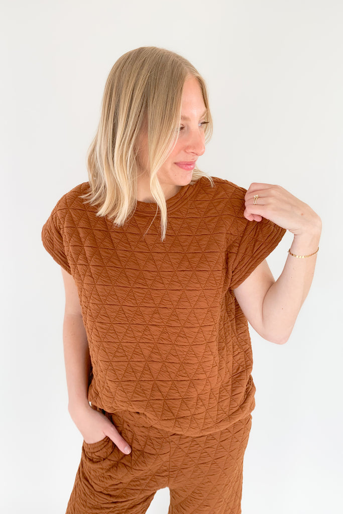 The Ashlee Quilted Short Sleeve Top is elevated with a unique quilted texture and boxy shape. It is very flattering and trendy while remaining comfortable. The style is not heavy either.