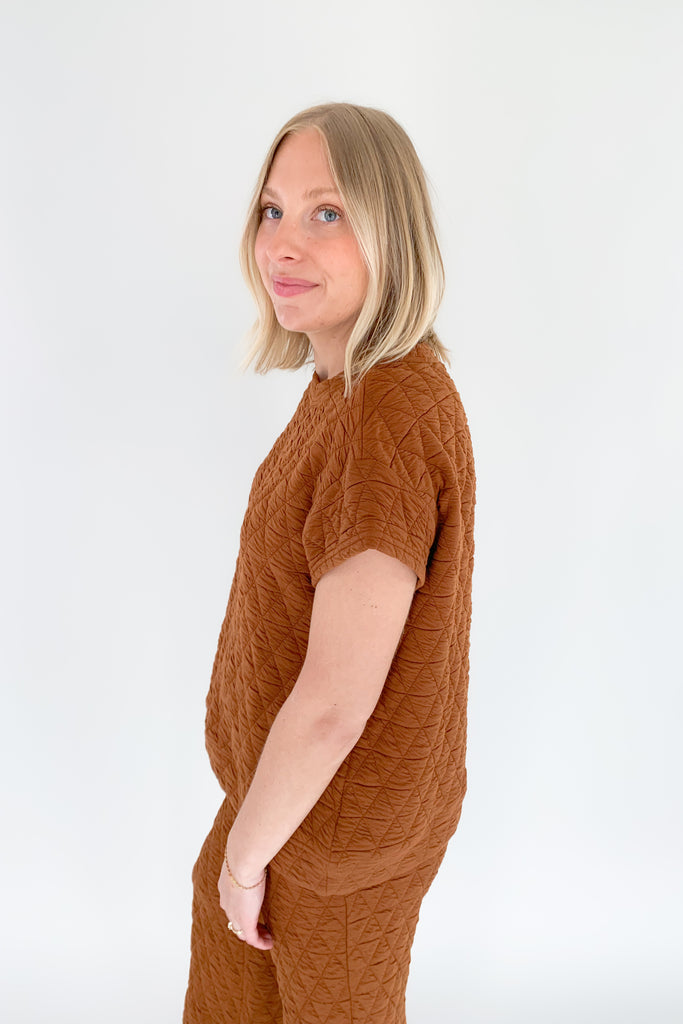 The Ashlee Quilted Short Sleeve Top is elevated with a unique quilted texture and boxy shape. It is very flattering and trendy while remaining comfortable. The style is not heavy either.