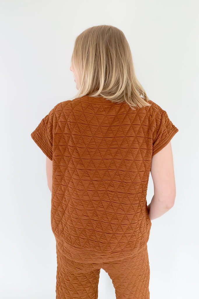 The Ashlee Quilted Short Sleeve Top is elevated with a unique quilted texture and boxy shape. It is very flattering and trendy while remaining comfortable. The style is not heavy either.