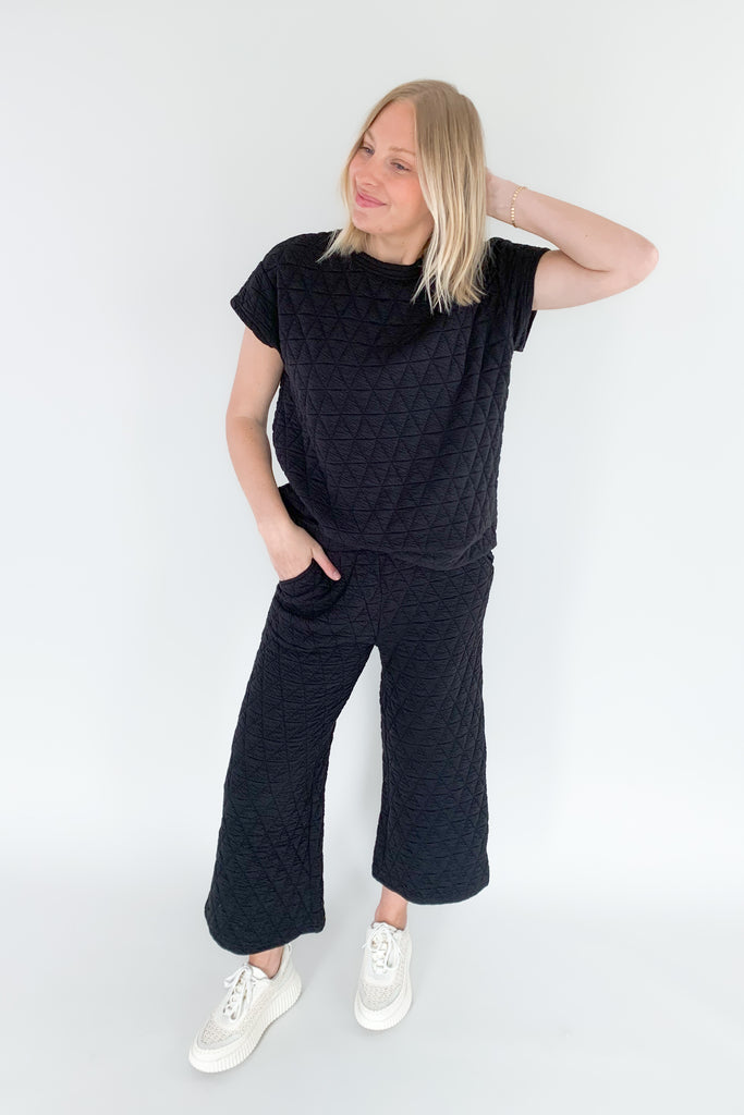 Stay warm and stylish with the Ashlee Quilted Pants! These medium weight lounger pants boast a textured fabric and feature an elastic waistband, side pockets, and wide leg fit.