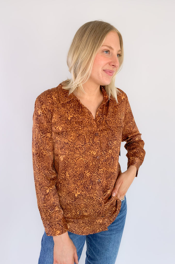 This wear with anything woven sateen blouse is a fabulous piece designed in by Liverpool Los Angeles. The exclusive Autumn Safari Button Up Printed Blouse pairs with denim or trousers for multiple looks.