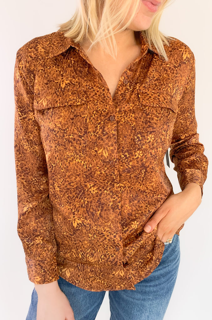 This wear with anything woven sateen blouse is a fabulous piece designed in by Liverpool Los Angeles. The exclusive Autumn Safari Button Up Printed Blouse pairs with denim or trousers for multiple looks.