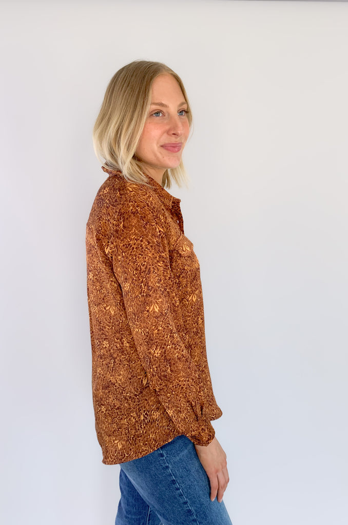 This wear with anything woven sateen blouse is a fabulous piece designed in by Liverpool Los Angeles. The exclusive Autumn Safari Button Up Printed Blouse pairs with denim or trousers for multiple looks.