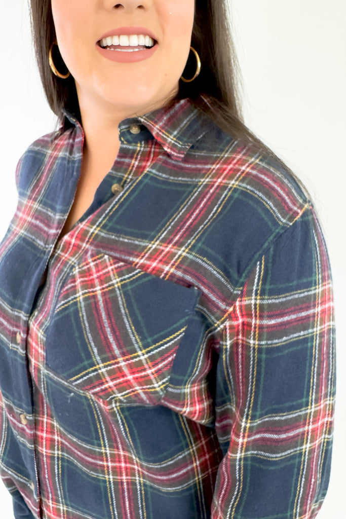Make a bold and confident statement with this Avril Classic Oversized Flannel! This eye-catching flannel features a bright blue base and striking red, green, yellow and white plaid stripes. It screams classic holiday and is a great layering piece. You can dress it up or down for countless looks. 