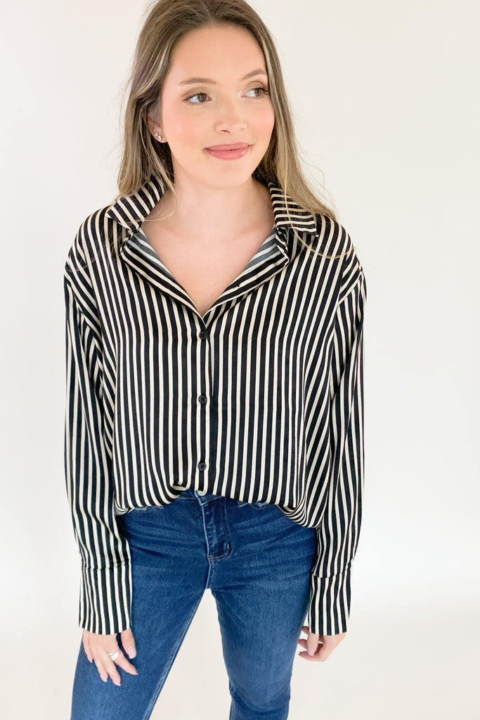 The Be Bold Striped Button Down Shirt is so elevated and pretty. It's perfect for a dressy office look, special event, or a night out. The fabric feels super elevated with its soft satin material. Because the stripes are black and beige, you will be wearing this timeless piece for years to come!
