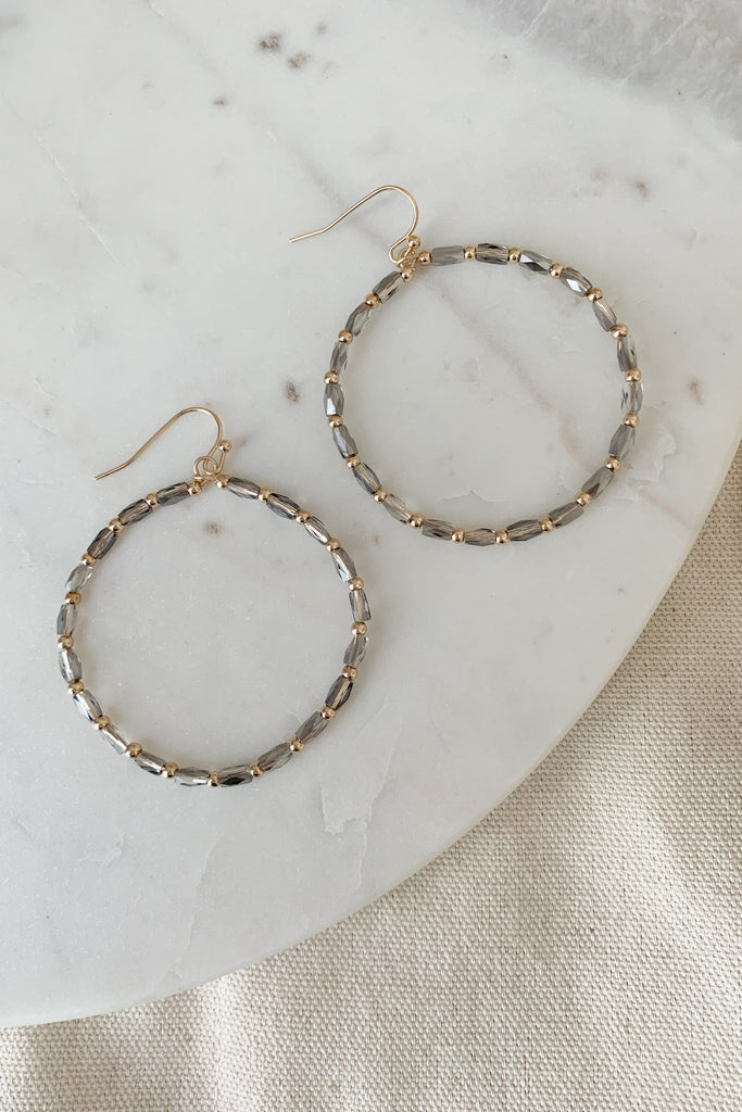The Beaded Circle Gold Grey Earrings are lightweight, unique, and oh so pretty! We love the grey gold combo. It has just the right amount of shimmer, perfect for elevating any outfit. They are also very lightweight too, despite their size and statement design. 
