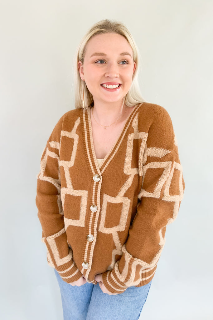 The Becky Patchwork Knit Cardigan is so cozy and fun! It mimics a trendy varsity cardigan with buttons along the front and striped hem, cuff, and neckline details. This style nothing like your average cardigan though, featuring the softest fabric and unique abstract design.