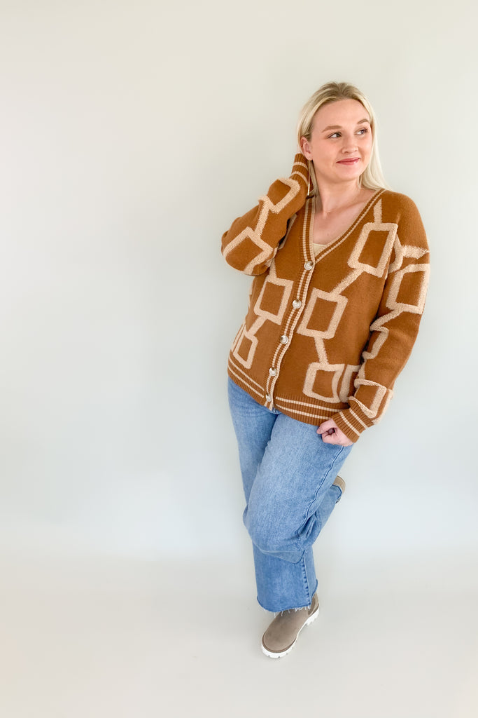 The Becky Patchwork Knit Cardigan is so cozy and fun! It mimics a trendy varsity cardigan with buttons along the front and striped hem, cuff, and neckline details. This style nothing like your average cardigan though, featuring the softest fabric and unique abstract design.