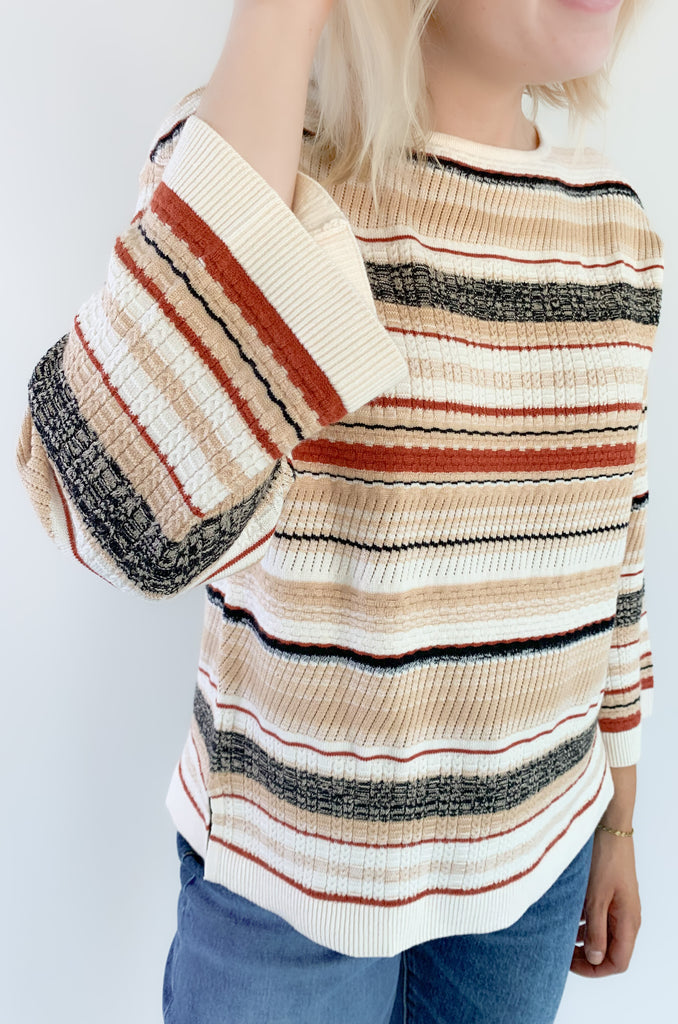 This Liverpool Los Angeles Boat Neck Textured Cream Stripe Sweater features side slits and beautiful rust and cream stripes. Not only is the color and print gorgeous, but the fabric feels like a dream.