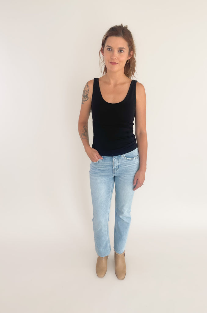 The Bon Basic Scoop Neck Tank is the ultimate layering piece, or wear it on its own for all-day comfort. It's lightweight, soft, stretchy, and semi-fitted. The scoop neck is very flattering too. It looks elevated and will layer well under anything! Plus, it is double-lined for more coverage. 