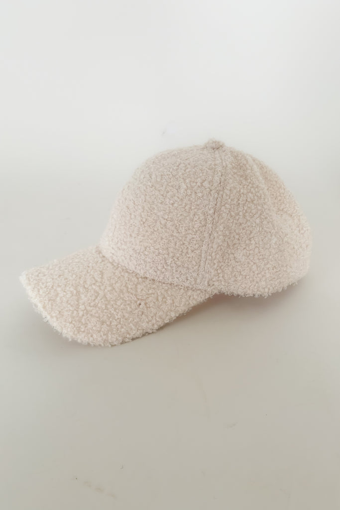 The Boucle Baseball Cap is a cute & trendy style that takes a casual hat to the next level! They are anything but boring, featuring a unique sherpa texture and cozy fit. These hats have an adjustable back too. 