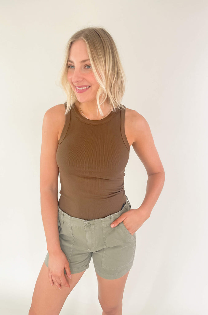 Introducing our Breanna Binding Tank Top - the perfect partner in fashion for all your hot weather escapades! It's soft, stretchy fabric is designed to keep you comfortable and looking cool, while its ribbed texture gives it an elevated touch of class. Choose between brown and black