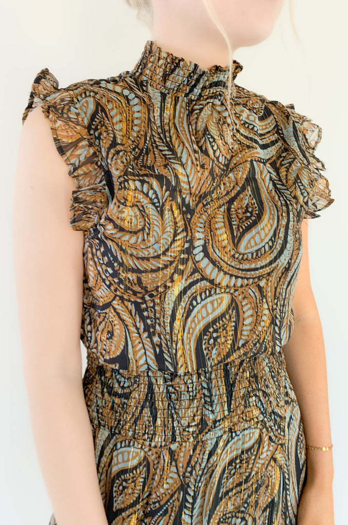 Look chic with our new Elan Brown Paisley sleeveless dress! Featuring a high ruffled neck and flounced bottom, you'll love the elevated silhouette. You can move freely in its sheer fabric while enjoying stunning details. The colors are a mix of teal, brown, black, and metallic gold. It truly is a dress that stands out and stands the test of time. You will be reaching for it year after year! 