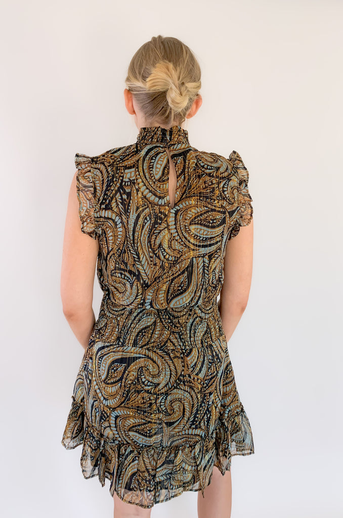Look chic with our new Elan Brown Paisley sleeveless dress! Featuring a high ruffled neck and flounced bottom, you'll love the elevated silhouette. You can move freely in its sheer fabric while enjoying stunning details. The colors are a mix of teal, brown, black, and metallic gold. It truly is a dress that stands out and stands the test of time. You will be reaching for it year after year! 