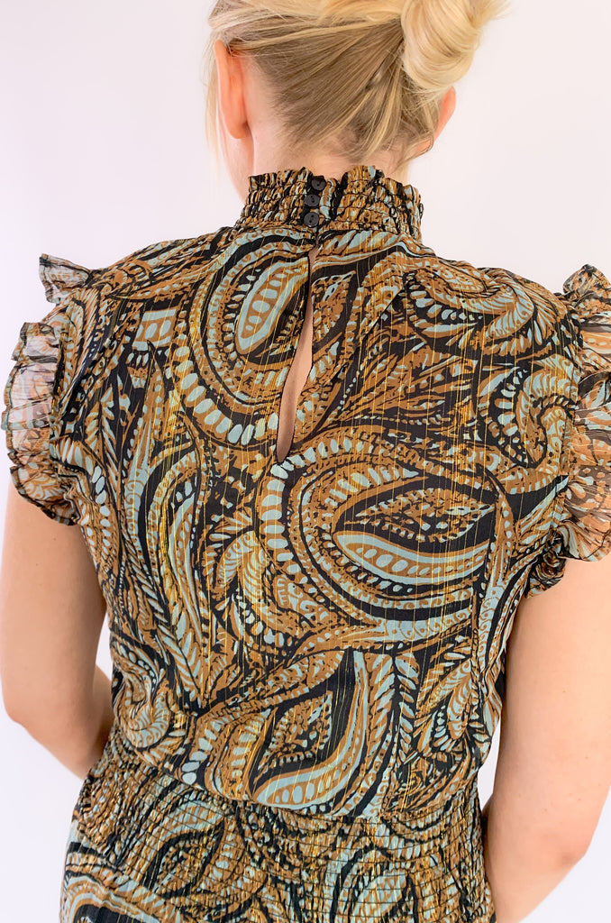 Look chic with our new Elan Brown Paisley sleeveless dress! Featuring a high ruffled neck and flounced bottom, you'll love the elevated silhouette. You can move freely in its sheer fabric while enjoying stunning details. The colors are a mix of teal, brown, black, and metallic gold. It truly is a dress that stands out and stands the test of time. You will be reaching for it year after year! 
