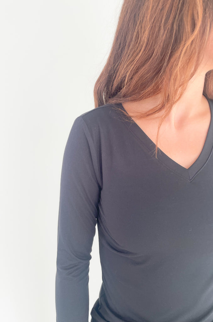 The Black Brushed Microfiber Long Sleeve V Neck is an amazing basic! It's semi-fitted with a soft and stretch material. 