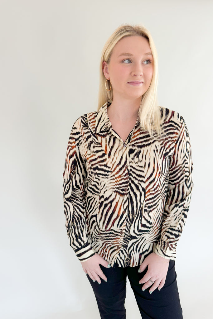 Make a statement with this chic animal print woven blouse by Liverpool!  Featuring a button front and patchwork design, this top is stylish and comfortable.We love the mixed zebra inspired print too. It's so fun, plus the fabric feels super silky soft!