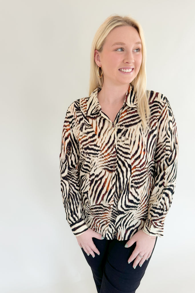 Make a statement with this chic animal print woven blouse by Liverpool!  Featuring a button front and patchwork design, this top is stylish and comfortable.We love the mixed zebra inspired print too. It's so fun, plus the fabric feels super silky soft!