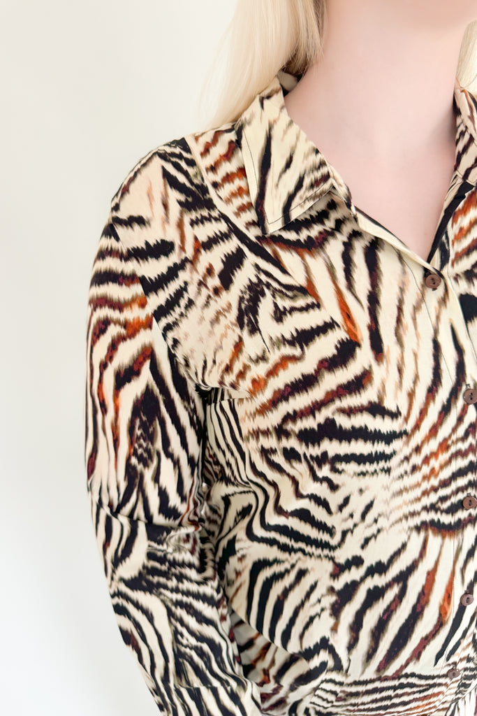 Make a statement with this chic animal print woven blouse by Liverpool!  Featuring a button front and patchwork design, this top is stylish and comfortable.We love the mixed zebra inspired print too. It's so fun, plus the fabric feels super silky soft!