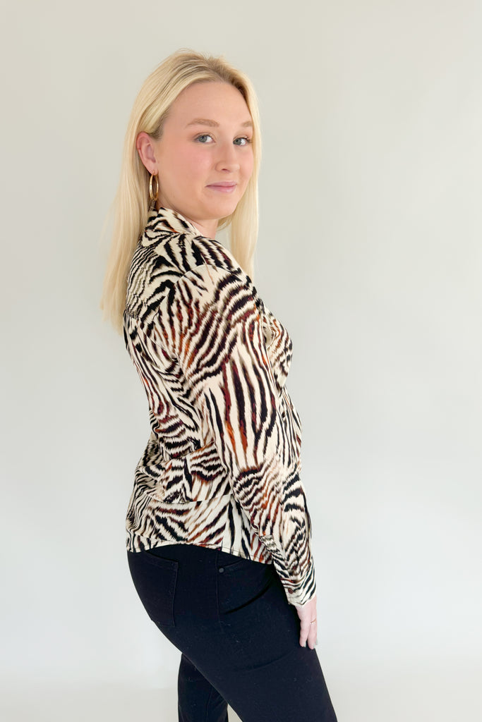 Make a statement with this chic animal print woven blouse by Liverpool!  Featuring a button front and patchwork design, this top is stylish and comfortable.We love the mixed zebra inspired print too. It's so fun, plus the fabric feels super silky soft!
