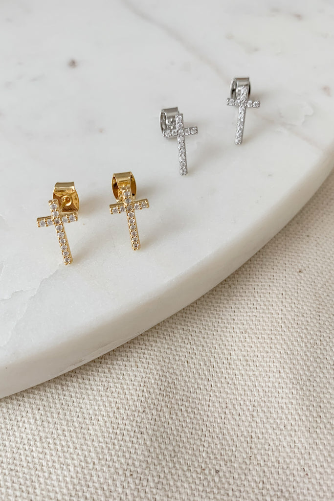 The CZ Sterling Silver Cross Studs are gold dipped over sterling sliver. This coating process ensures long lasting, color protecting shine to your jewelry. The CZ studs add a little sparkle too. These Cross Studs are so sweet and would make such a special gift. We love them!