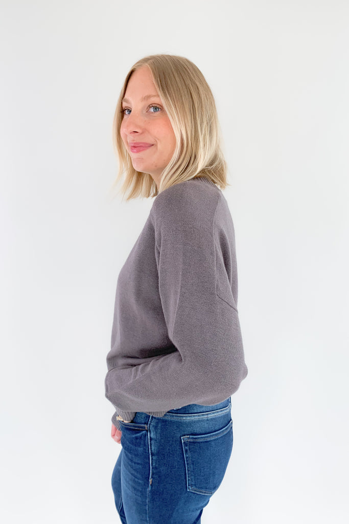 The Charlotte Avery Callum Cropped Crewneck Sweater is ultra soft and cute for everyday wear. Plus, the color is really fun. It's a smokey heather grey that will pair with so many looks. This style also is slightly cropped with an oversized fit. It's perfect for those days you want to feel cozy, but look cute. 