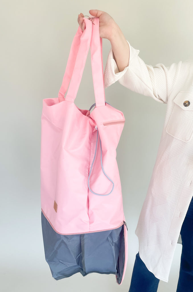 Get organized on-the-go with this fun tote! It has a zipper bottom, perfect for shoes and extra storage. It closes on the top with two drawstrings on the side. 