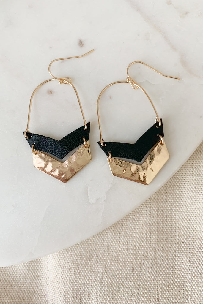 The Chevron Leather & Metal Drop Earrings are super fun with a unique hammered design and leather details. They have a touch of boho, are lightweight, and make a cool statement. 