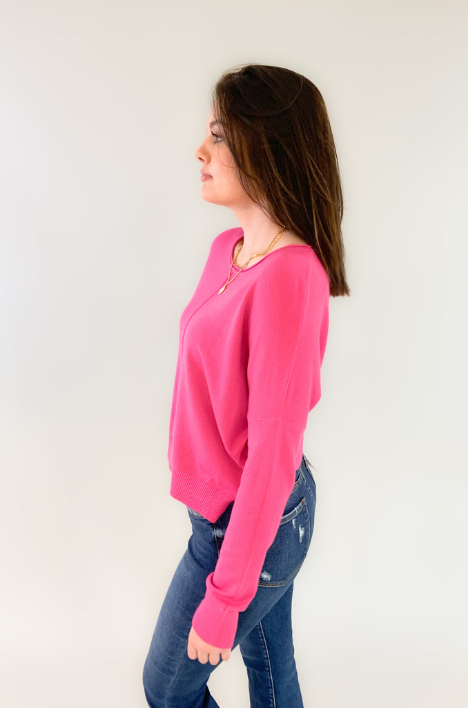 round neck, center seam sweater with soft stretchy fabric made by Dreamers. Semi-cropped with slits at the sides