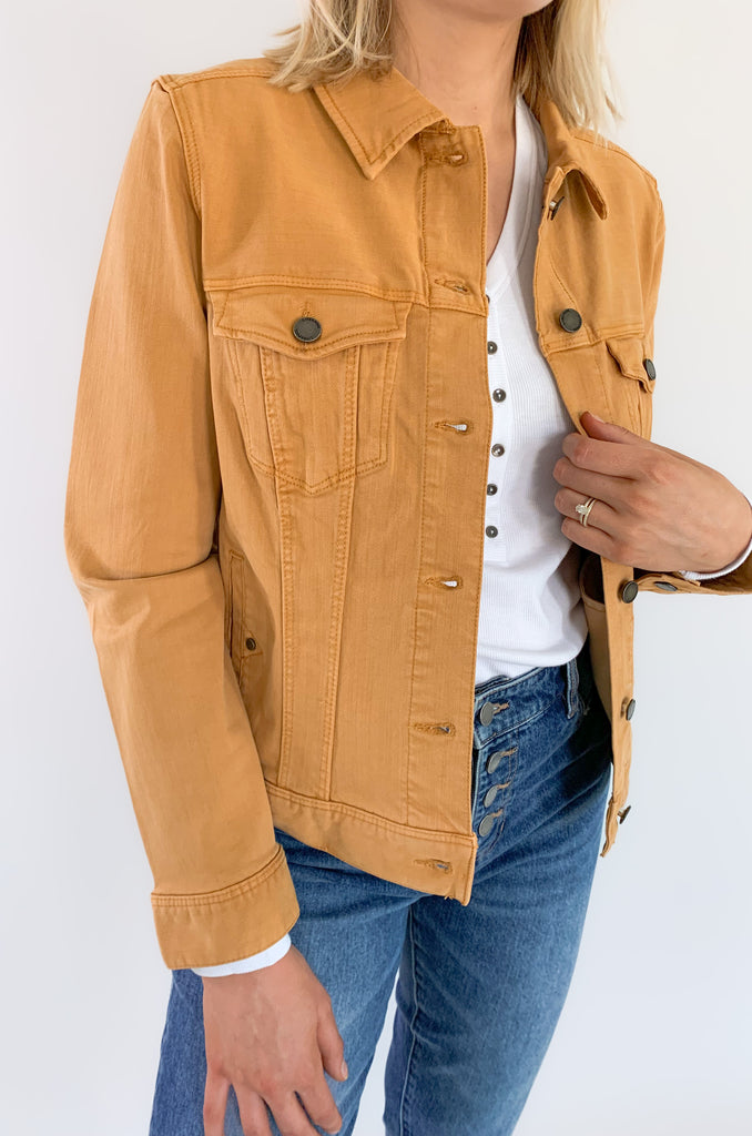 The Liverpool Los Angeles Classic Amber Dawn Jean Jacket is perfect for fall! The color is a unique cross between a burnt mustard and orange. With amazing stretch and recovery, this classic jean jacket will be your new go-to layering piece. It adds a unique touch to any look and a little pop of color.