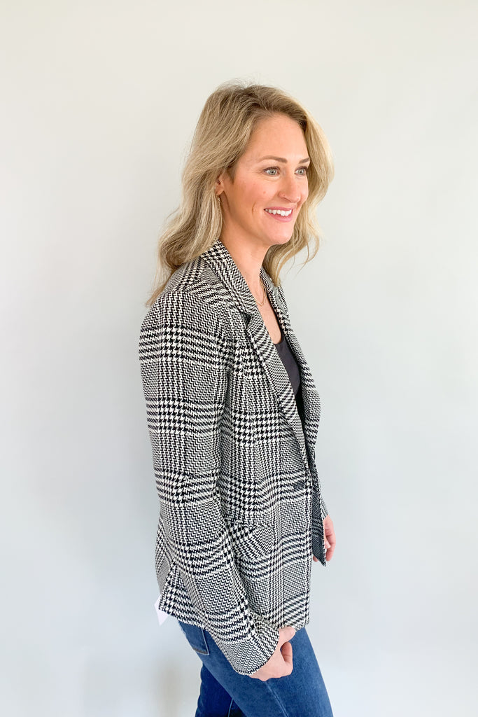 Look sophisticated and chic in this classic black and off-white plaid blazer! Its fashionable design guarantees a timeless look that you'll love wearing all the time. You can wear it through many seasons, but would be gorgeous for holidays or work. We kept our look casual by pairing it with a basic tank and denim. 