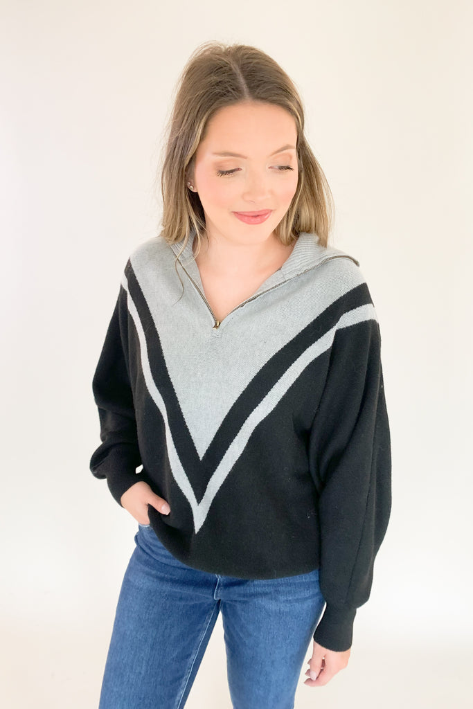 This Elan Collared Dual V Sweater is the perfect combination of cozy comfort and timeless style! With elevated fabric and soft feel, you'll look and feel your best in any setting. It has a preppy flare with the black and and grey stripe details along the neckline, as well as the zip collar. This sweater is undoubtedly a comfortable option for everyday.  