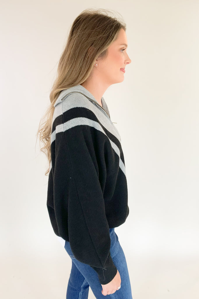 This Elan Collared Dual V Sweater is the perfect combination of cozy comfort and timeless style! With elevated fabric and soft feel, you'll look and feel your best in any setting. It has a preppy flare with the black and and grey stripe details along the neckline, as well as the zip collar. This sweater is undoubtedly a comfortable option for everyday.  