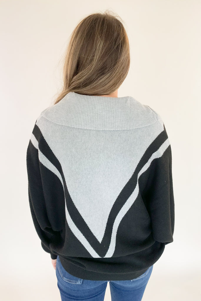 This Elan Collared Dual V Sweater is the perfect combination of cozy comfort and timeless style! With elevated fabric and soft feel, you'll look and feel your best in any setting. It has a preppy flare with the black and and grey stripe details along the neckline, as well as the zip collar. This sweater is undoubtedly a comfortable option for everyday.  